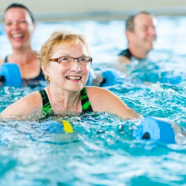 Woman having hydrotherapy session in pool